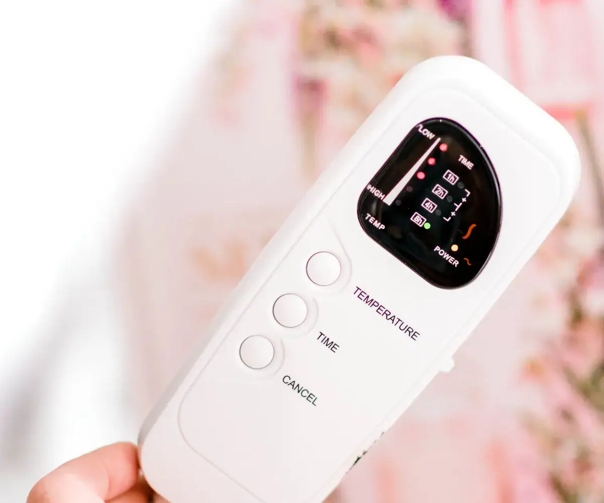 Heated treatment bed control inside a private suite at The Lash Spa