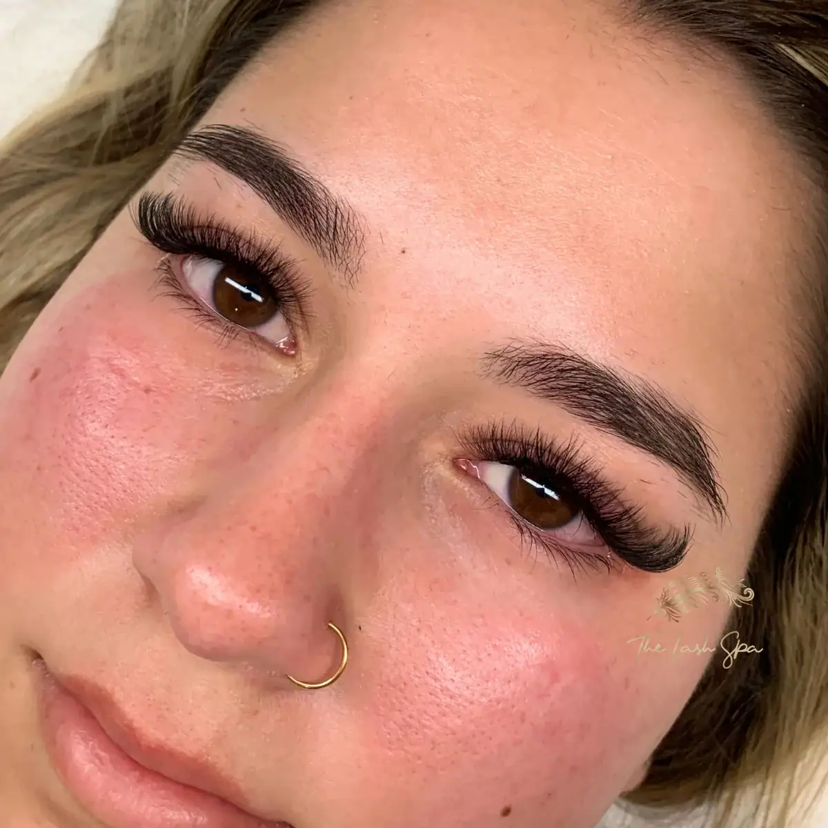 Angled view of full Max Volume lash extensions