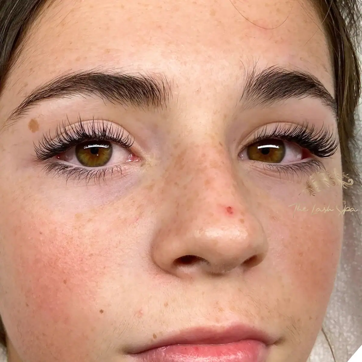Close front view of Soft Dimension extensions on brown eyes