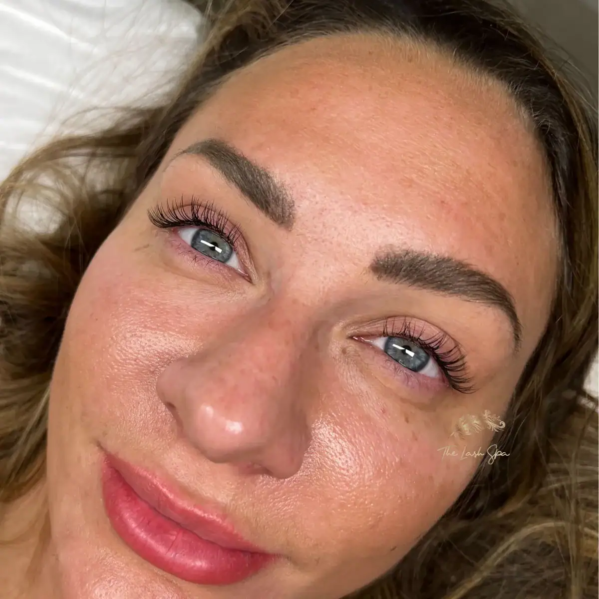 Tailored Classic extensions framing a guest’s blue eyes